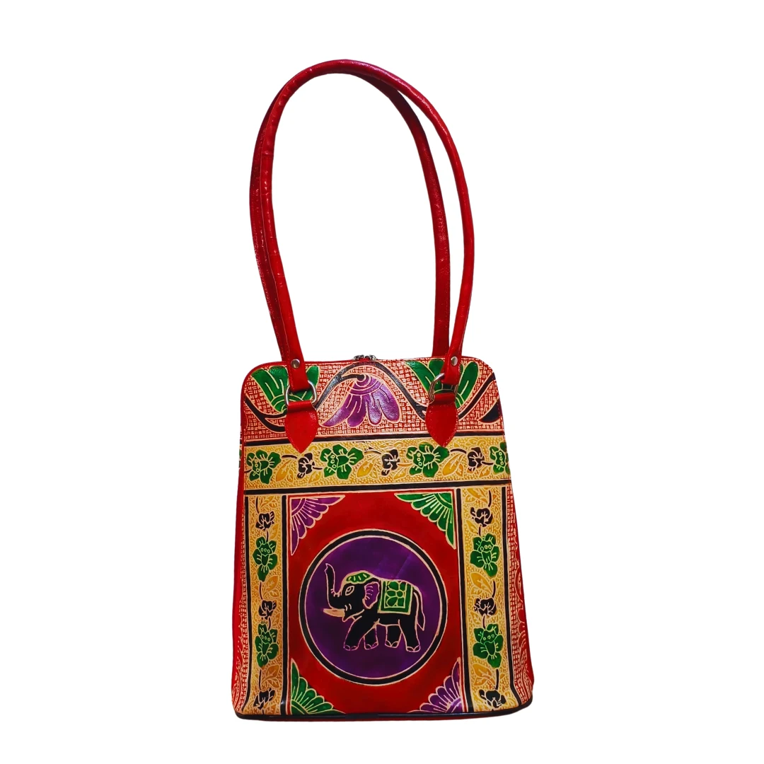 Genuine TC Leather Tote Bag with Handcrafted Elephant Motif – Chitrahar Boutique Red and multicolor genuine TC leather tote bag with long handles and an intricate painted elephant motif surrounded by floral and geometric designs.
